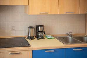 Microwave, stovetop, dishwasher, cookware/dishes/utensils