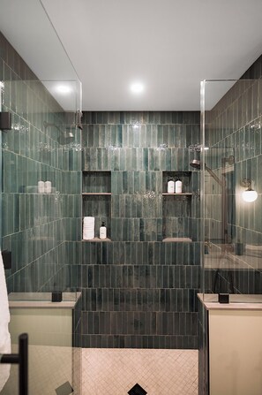 Shower, hair dryer, towels, toilet paper