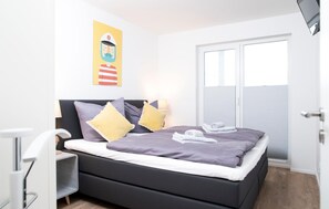 2 quartos, ferros/tábuas de passar roupa, berço de viagem