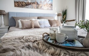 2 habitaciones, tabla de planchar con plancha y cuna de viaje 