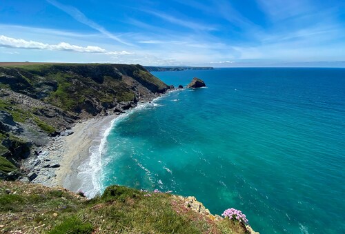 Situated only sixty meters from the Blue Flag sandy beach in the charming coastal village of Porthto