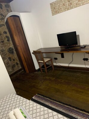 Laptop workspace, bed sheets
