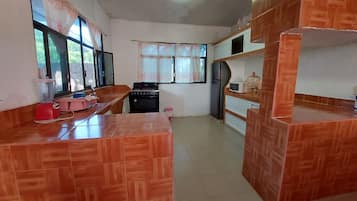 Fridge, microwave, blender, cookware/dishes/utensils