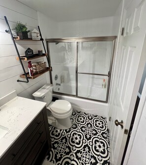 Shower, hair dryer, towels, soap