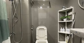 Shower, free toiletries, hair dryer, slippers