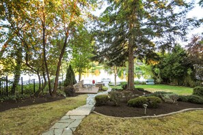 Private fenced back yard with lake access and view