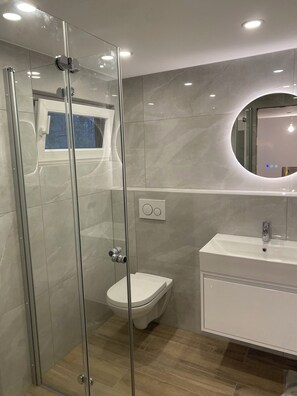 Shower, hair dryer, towels, soap