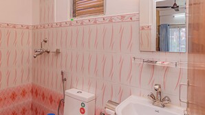 A bathroom with a toilet, sink, and shower. - Basundhara Resort Pokhara (Pokhara)