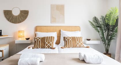 Wake up near the beach in a cozy room with boxspring beds, space for your child, and a free coffee!