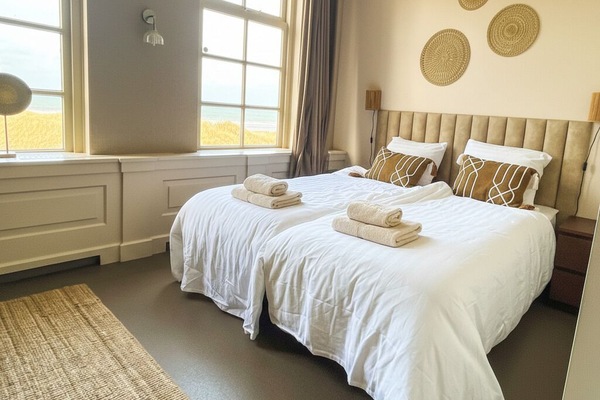 Cozy bedroom perfect for your Last Minute Zeeland getaway.