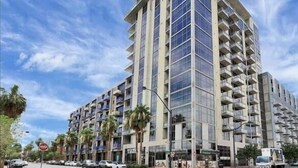 A high-rise building with multiple balconies and a modern architectural design. - Balcony Luxury High Rise Downtown Fremont Casinos (Las Vegas)
