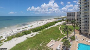 A beachfront hotel with a swimming pool, beach access, and a view of the ocean. - LIFE IS BETTER AT THE BEACH! ESTERO BEACH & TENNIS CLUB 603B! (Fort Myers Beach)
