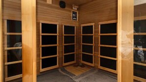 A sauna room with wooden walls and benches. - Romantic Wine Country Retreat Spa-Hot Tub & Sauna (Burdett)