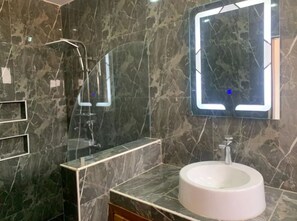 Shower, towels, soap, toilet paper