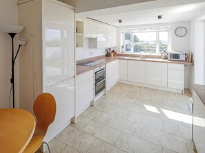 Dishwasher, high chair, cookware/dishes/utensils - 4 bedroom accommodation in Morfa Nefyn, Pwllheli (Morfa Nefyn, Pwllheli)