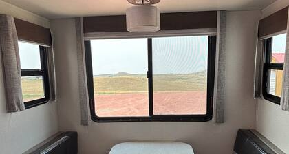 Tremendous camper with A/C and full hookups. Close to the Camplex.