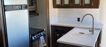 Tremendous camper with A/C and full hookups. Close to the Camplex. 