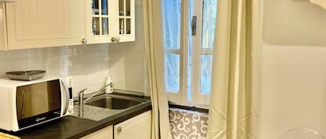 Microwave, stovetop, coffee/tea maker, toaster