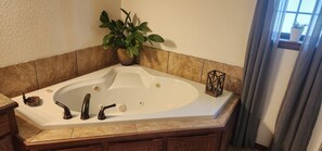 Jetted bath, hair dryer, towels, soap