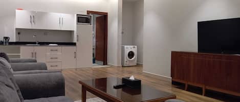 Apartment three bed rooms -6 Beds | Living area | 5-cm LED TV with satellite channels