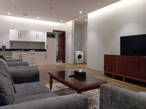 Apartment three bed rooms -6 Beds | Living area | 5-cm LED TV with satellite channels
