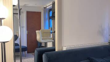 The Azures Suite | Living area | 50-inch Smart TV with satellite channels, Netflix, streaming services