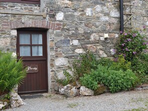 A stone building with a wooden door labeled "Parsley." - 2 bedroom accommodation in Dunterton, near Tavistock (Dunterton, near Tavistock)