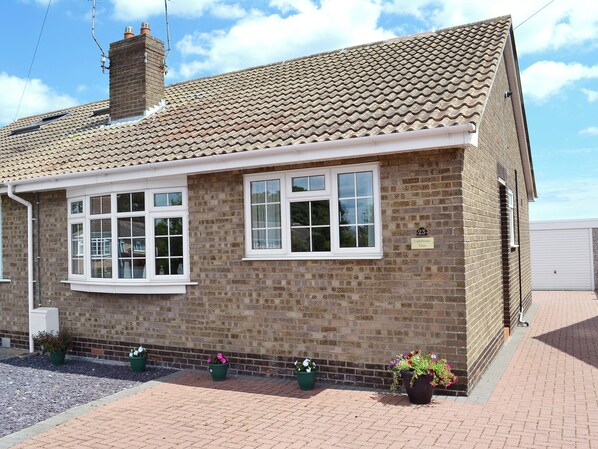 A brick building with a tiled roof, white-framed windows, and a sign indicating 'Lighthouse View.' - An excellent base to explore the North Yorkshire Coast. (Flamborough near Bridlington)