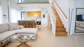 Deluxe Villa | Living area | Flat-screen TV