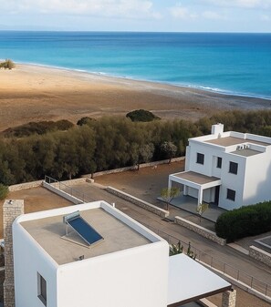 On the beach, sun loungers, beach towels
