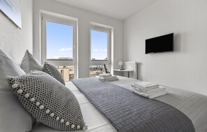 2 chambres, coffre-fort, fer et planche à repasser, lit de bébé portatif