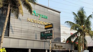 A hotel named Aryaas with a sign indicating 'Rooms Available'. - Aryaas Residency Nettoor (Kanayannur)