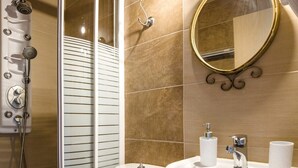 A bathroom with a shower, toilet, sink, and a mirror. - Studio Apartment 'Adamantia Newly Built Apartment A2' with Shared Terrace (Gaios)
