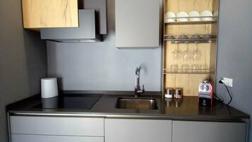 Fridge, stovetop, coffee/tea maker, cookware/dishes/utensils