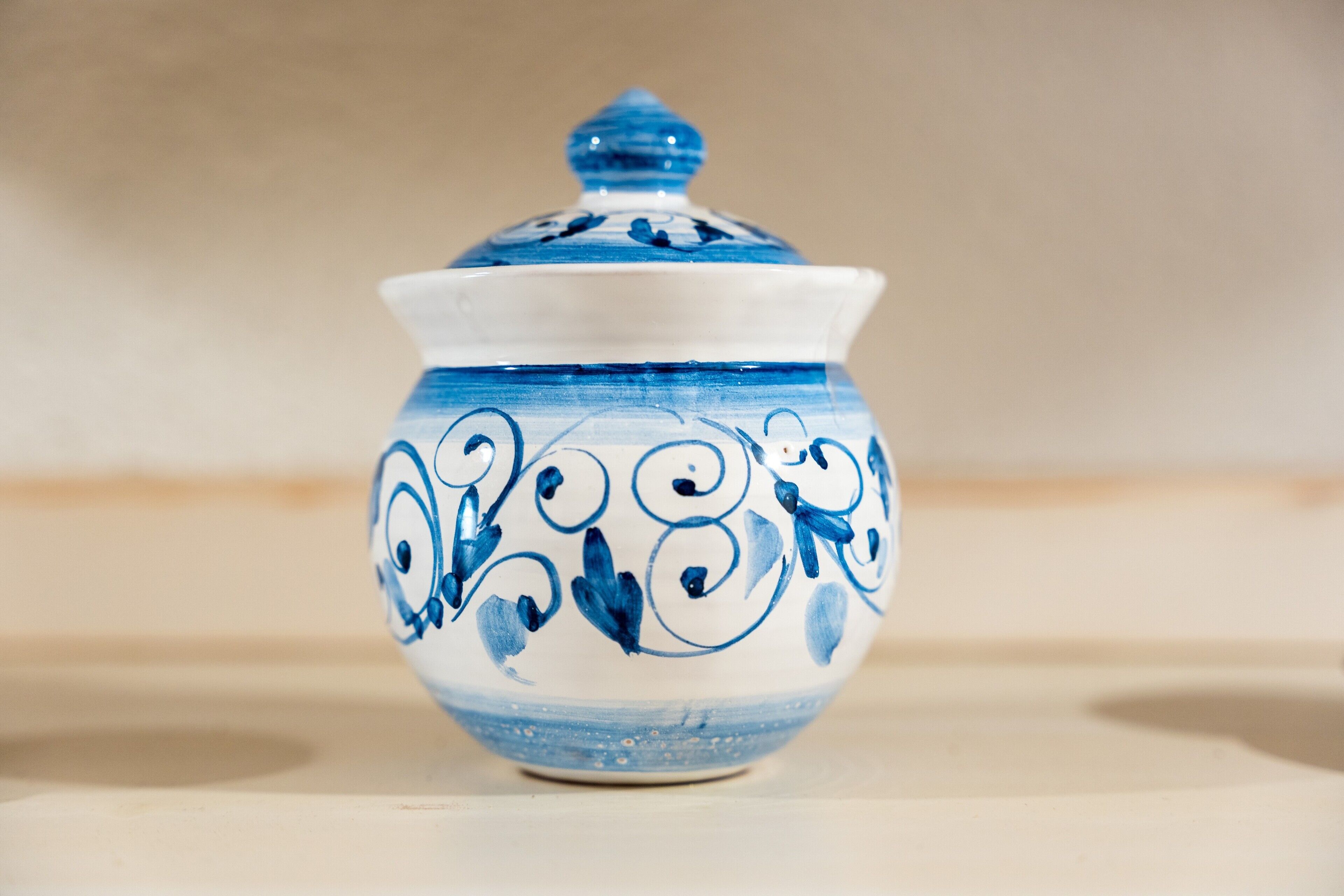 A ceramic pot with a lid.