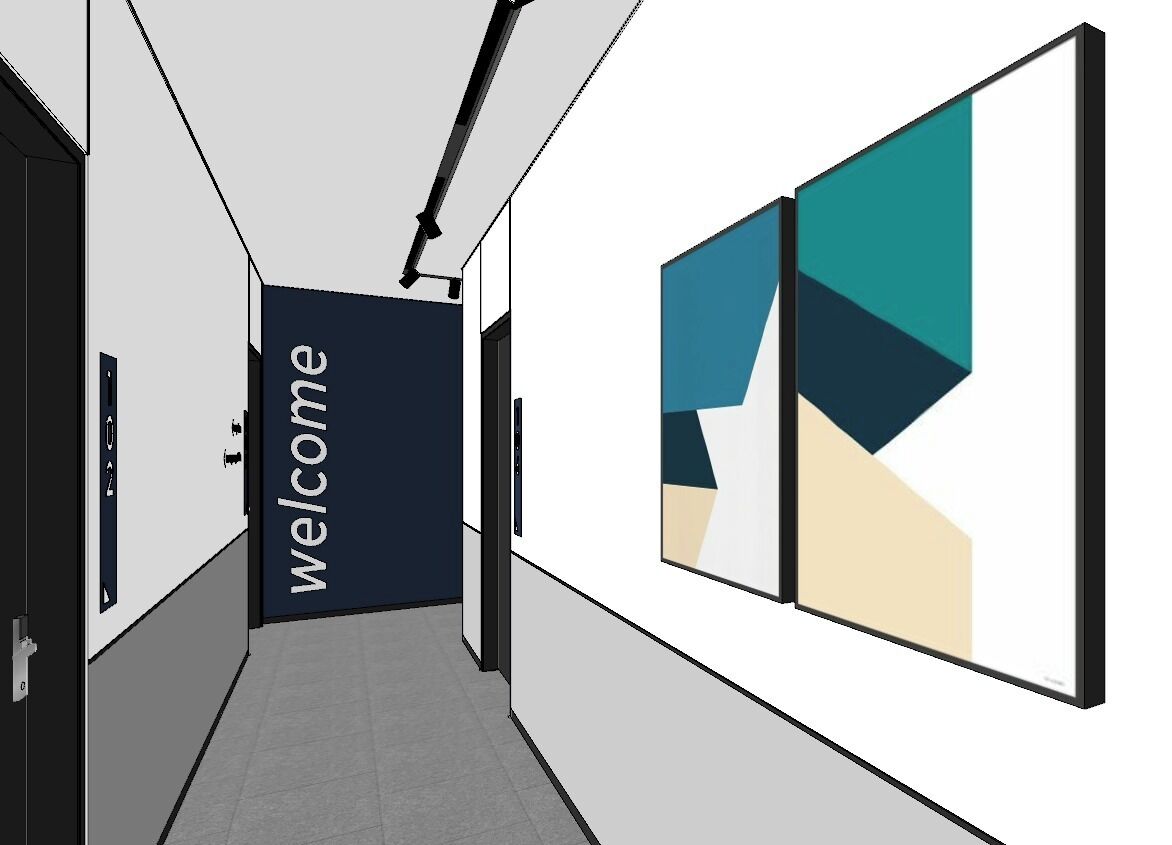 Un couloir avec une pancarte « Bienvenue », des œuvres d’art géométriques sur les murs et une porte sur le côté gauche.