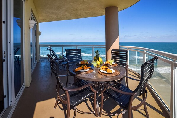 Outdoor dining - Ocean Vistas 1009 Oceanfront 3BD/3BA Condo with huge SE balcony. (Daytona Beach)