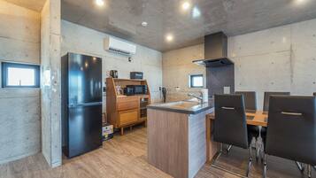 Basic Condo | Living area | 75-inch flat-screen TV with digital channels