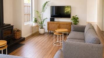 Family House, Garden View | Living area | 55-inch TV with digital channels