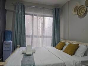 1 dormitorio, tabla de planchar con plancha, wifi gratis y ropa de cama