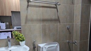 A bathroom with a sink, bidet, and shower. - Jali Stays, Serenity in Nairobi City (Nairobi)