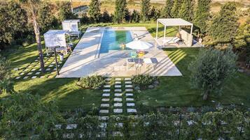 Outdoor pool, open 8:00 AM to 8:00 PM, free cabanas, pool umbrellas