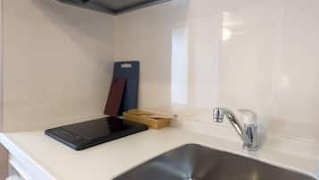 Family Condo, Balcony | Private kitchen | Electric kettle