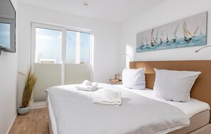 2 quartos, ferros/tábuas de passar roupa, berço de viagem