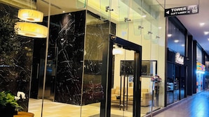 A modern hotel lobby with a glass facade, marble flooring, and a sign indicating 'Tower 2 (Lift Lobby 2)'. - M city ampang KL by Rit (Kuala Lumpur)
