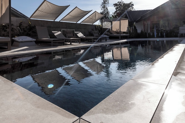 Seasonal outdoor pool, open 6:00 AM to 10:00 PM, free cabanas