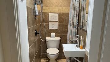 Shower, towels, soap, toilet paper