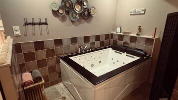 Jetted bath, towels, soap, toilet paper