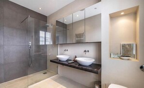 Separate tub and shower, deep soaking tub, towels
