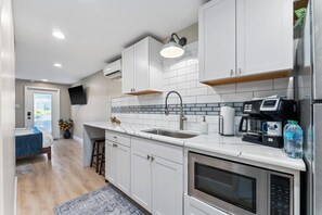 Fridge, microwave, coffee/tea maker, toaster